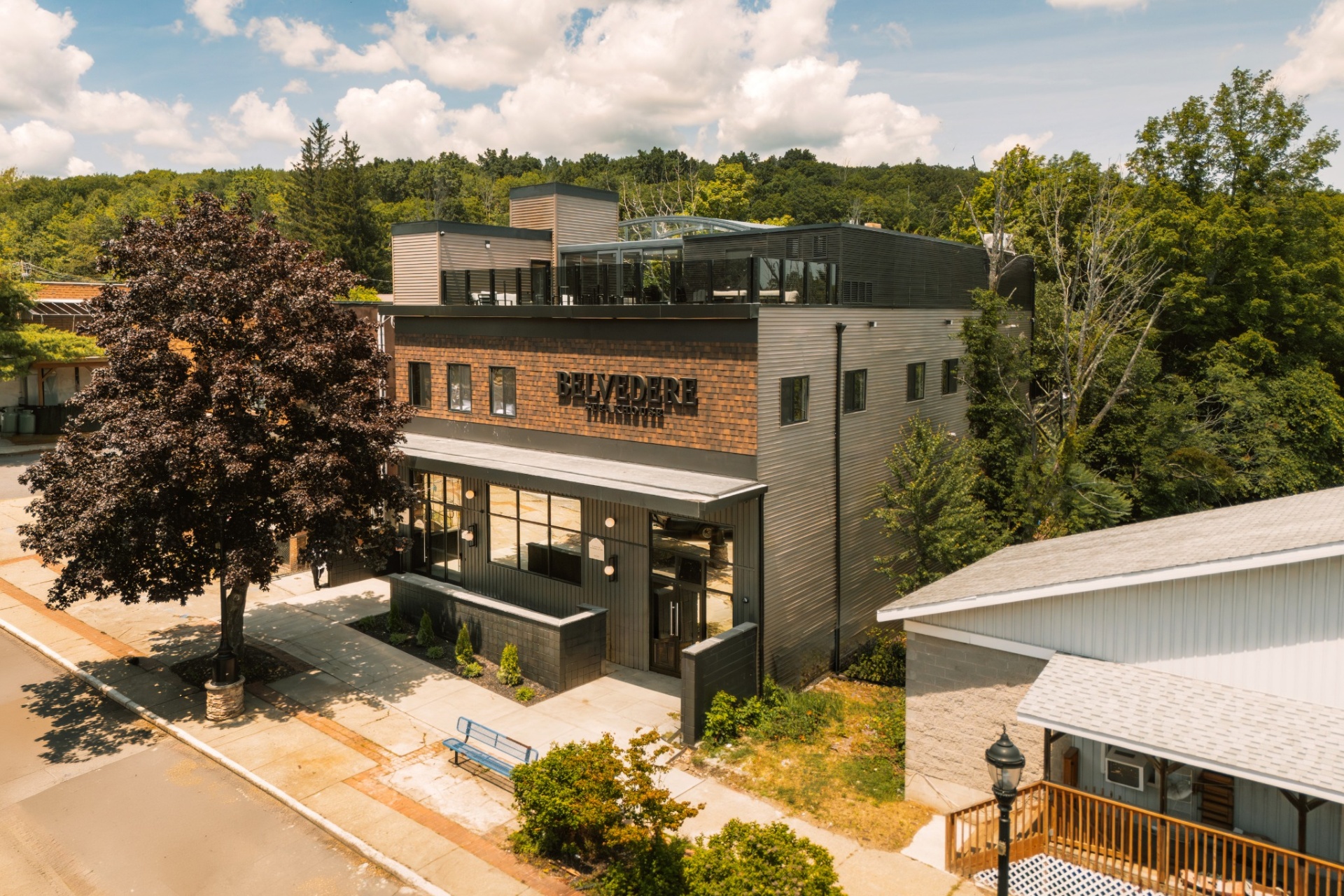 Corner aerial view of The Belvedere Suites building and entrance walkway