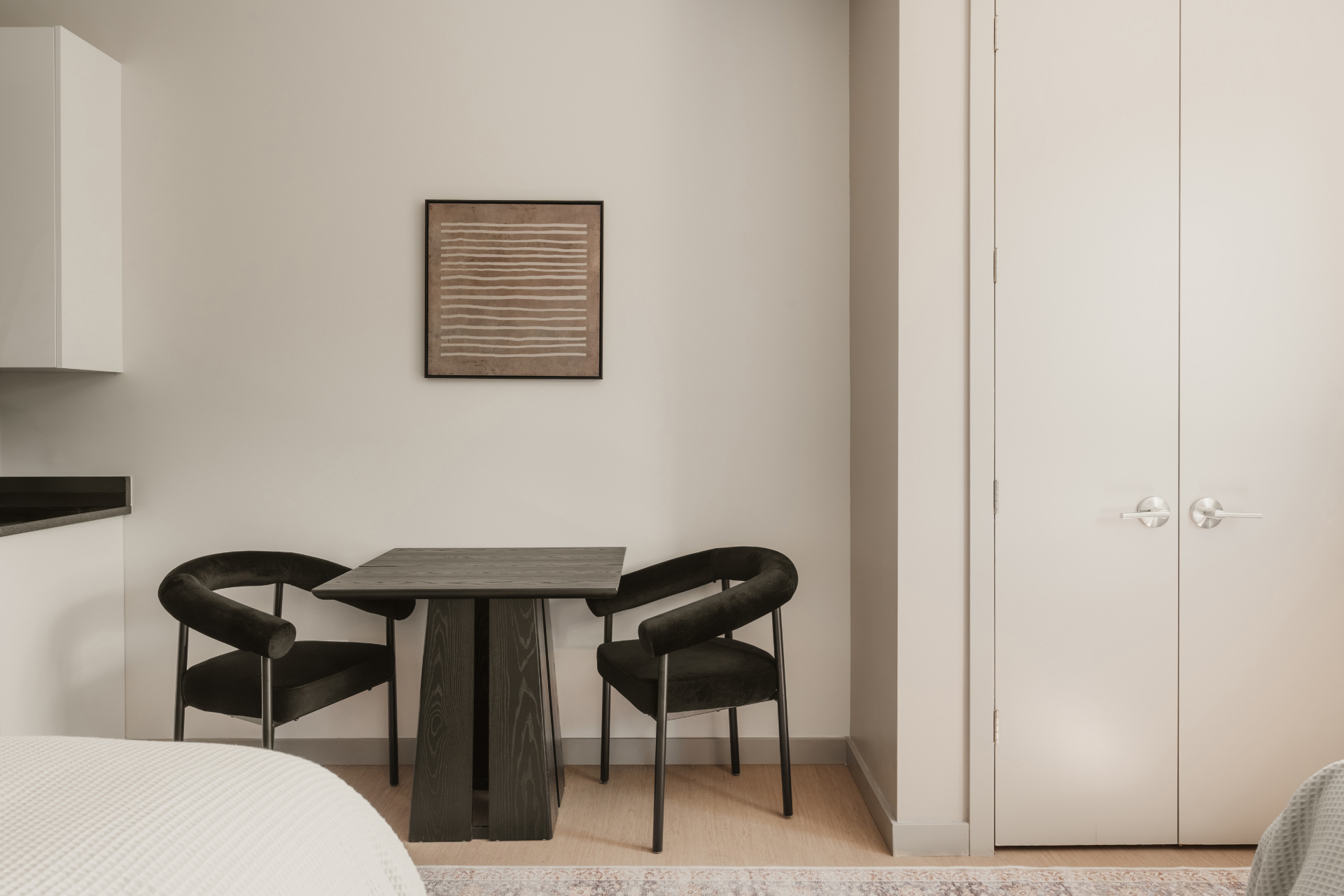 In-room dining table with two chairs beside the wardrobe