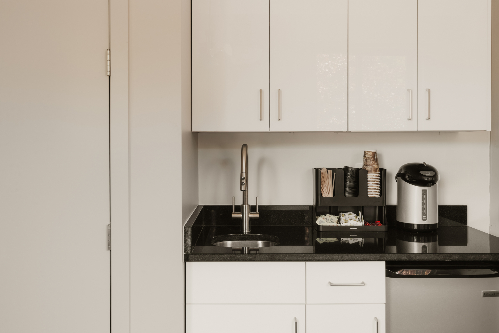 In-room kitchenette with coffee maker, kettle and sink