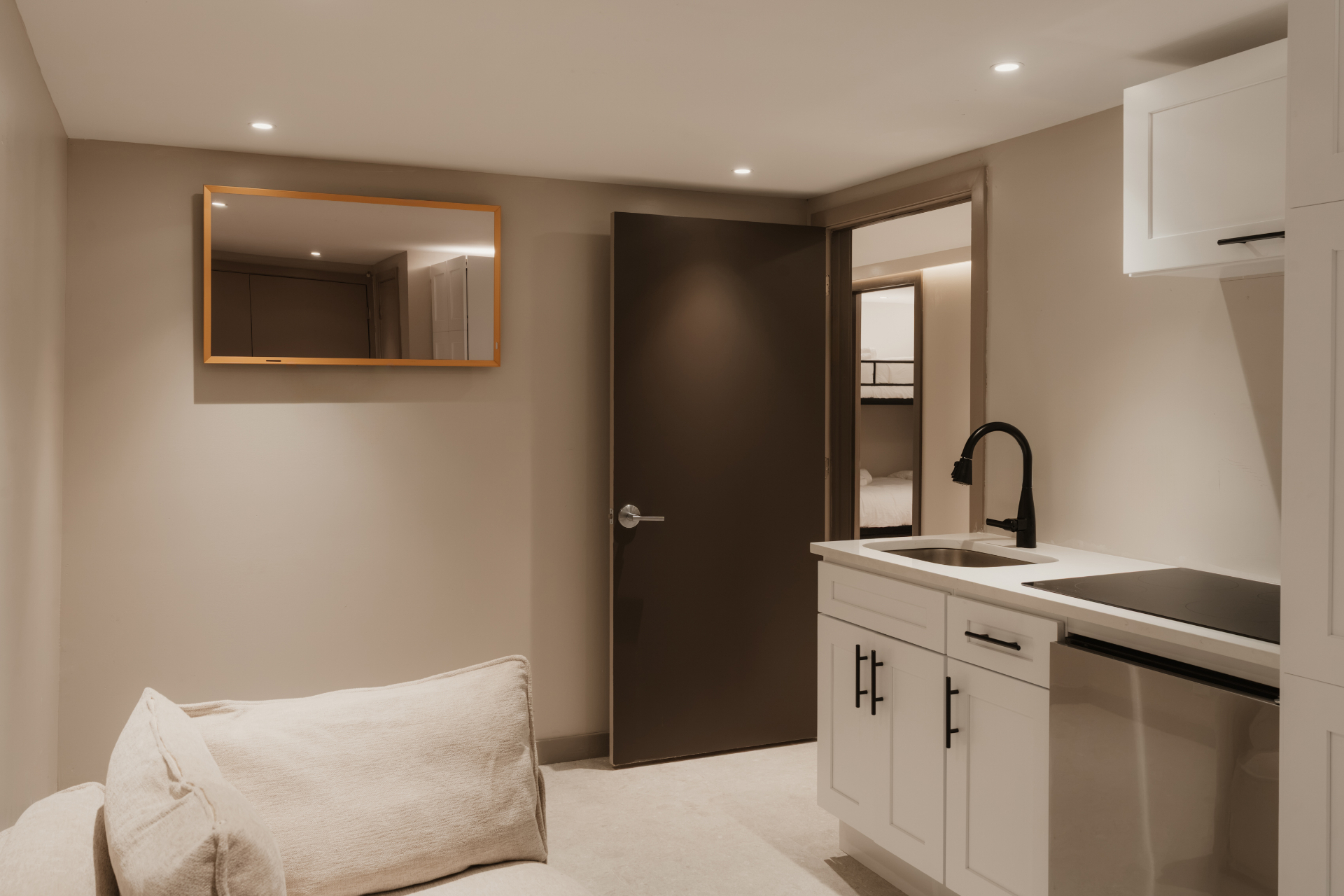 Bunk room with an adjoining kitchenette and sink