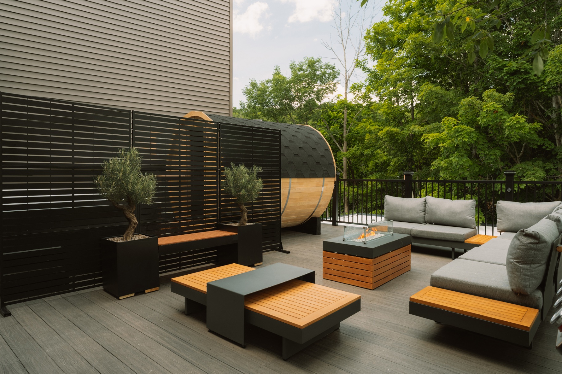 Modern teak and grey sectional lounge on the private outdoor deck