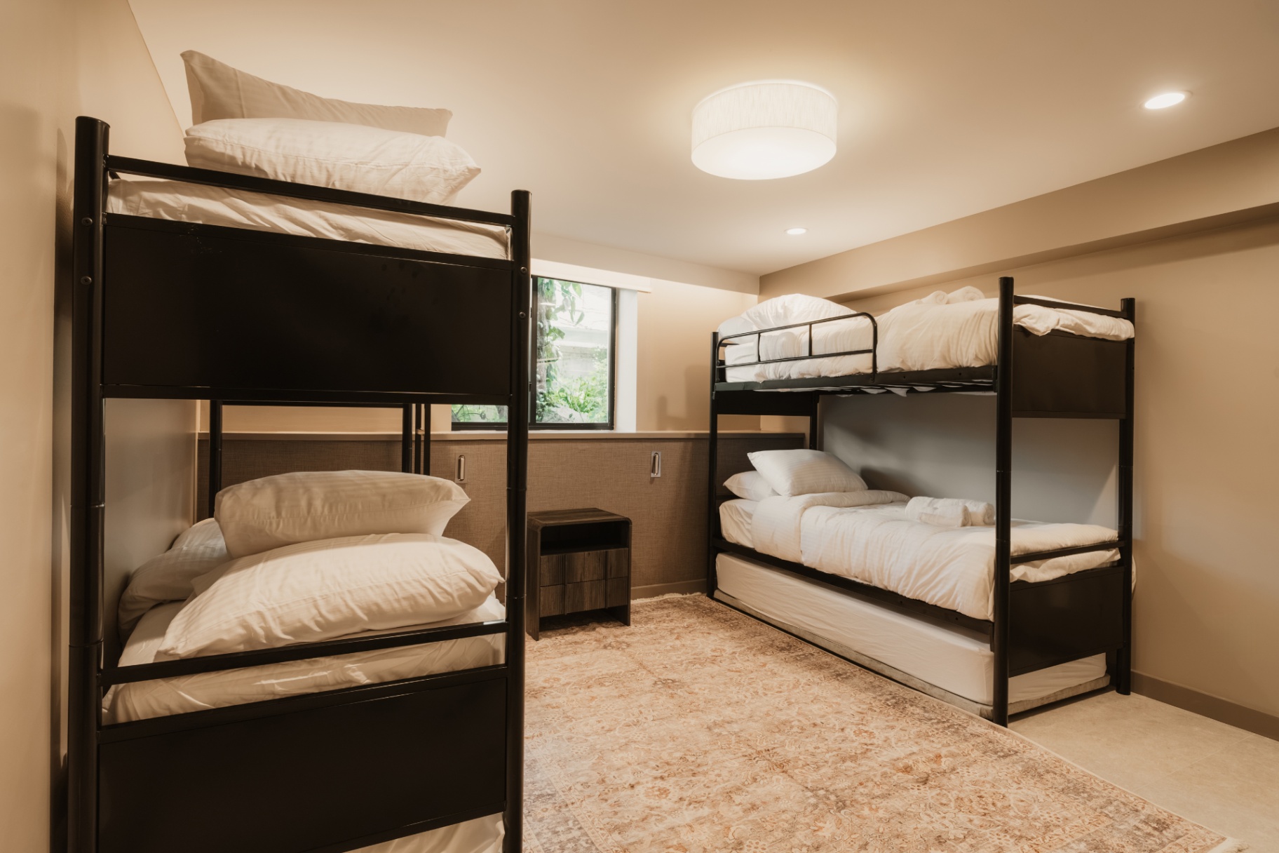 Bunk bed room with a window overlooking the grounds