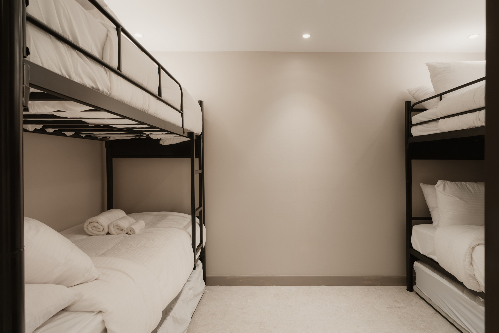 Bunk bed room with crisp white linens for families and groups
